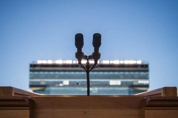 View of microphone from behind the podium at a Commencement ceremony